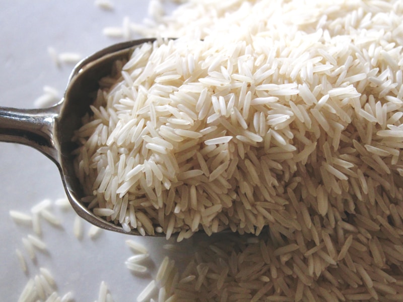 Metal scoop in milled white jasmine rice